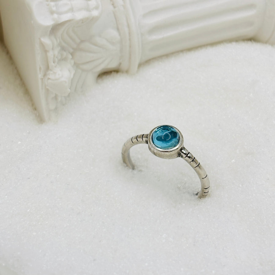 The adjustable vintage inspired silver ring features a blue crystal that adds a touch of retro charm and elegance to any outfit. Handmade, perfect for those who appreciate a touch of individuality in their accessories. 