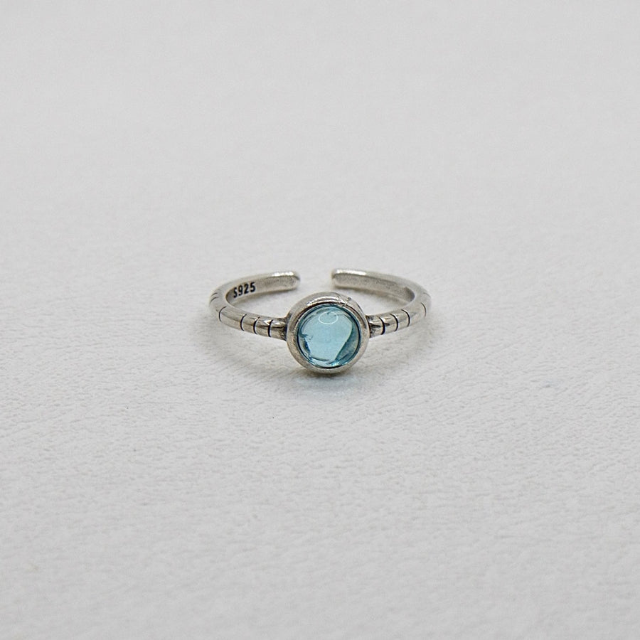 The adjustable vintage inspired silver ring features a blue crystal that adds a touch of retro charm and elegance to any outfit. Handmade, perfect for those who appreciate a touch of individuality in their accessories. 