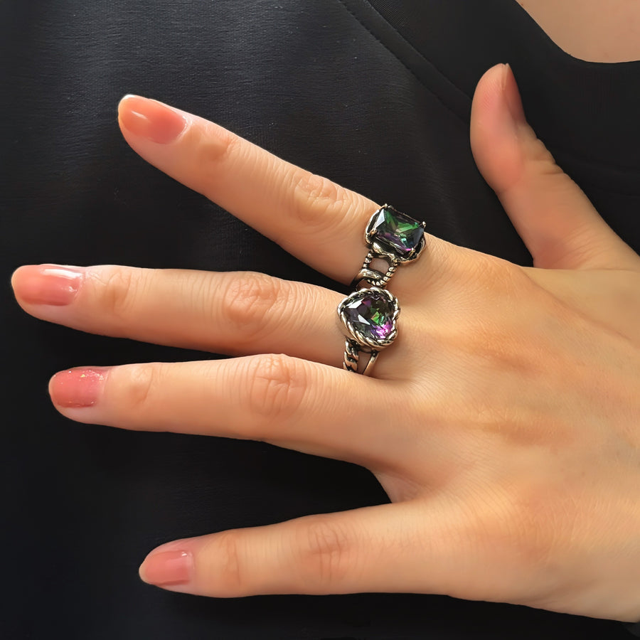 This adjustable brilliant crystal ring is a perfect example of high-quality, small-batch design. With a rectangular shaped, colorful crystal as the centerpiece, it showcases a vintage vibe and a contemporary sense of style.