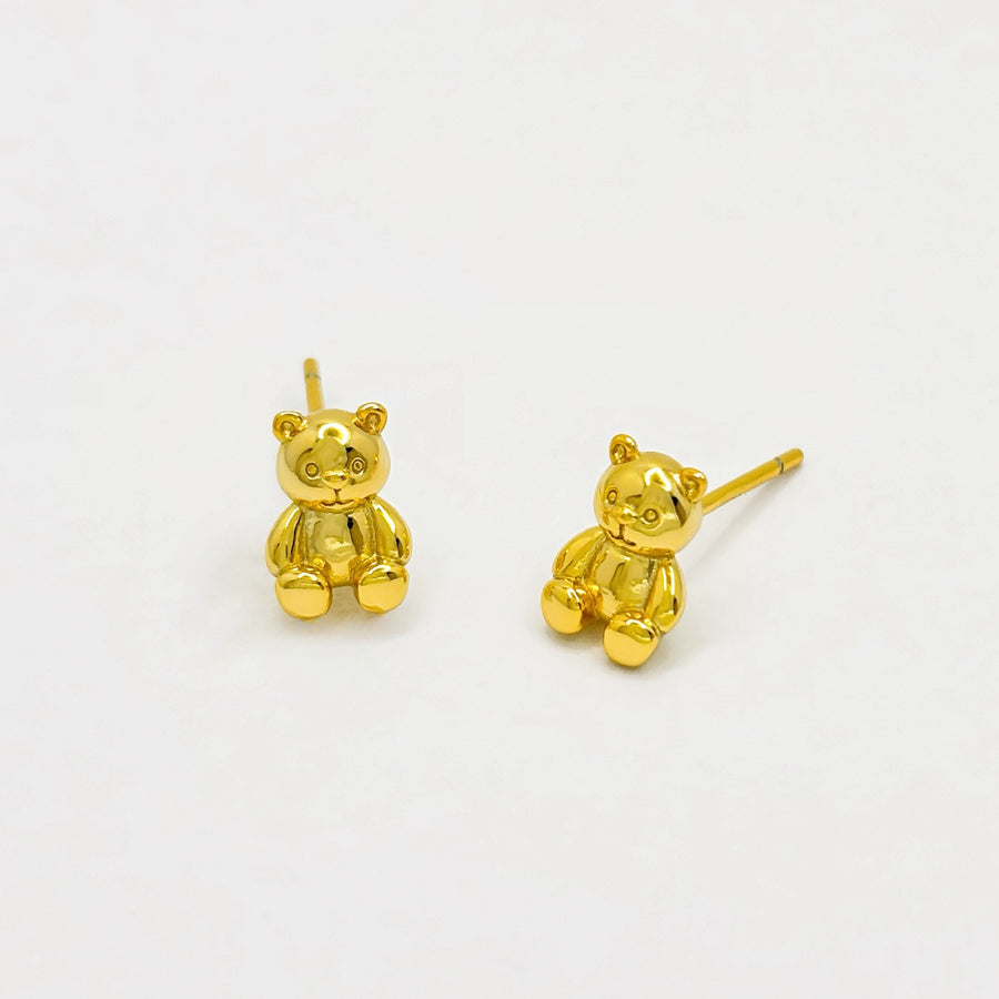 These adorable gold earrings feature a charming teddy bear design, perfect for adding a playful touch to any outfit. Crafted with attention to detail, these earrings are both cute and elegant, making them an ideal accessory for both children and adults.