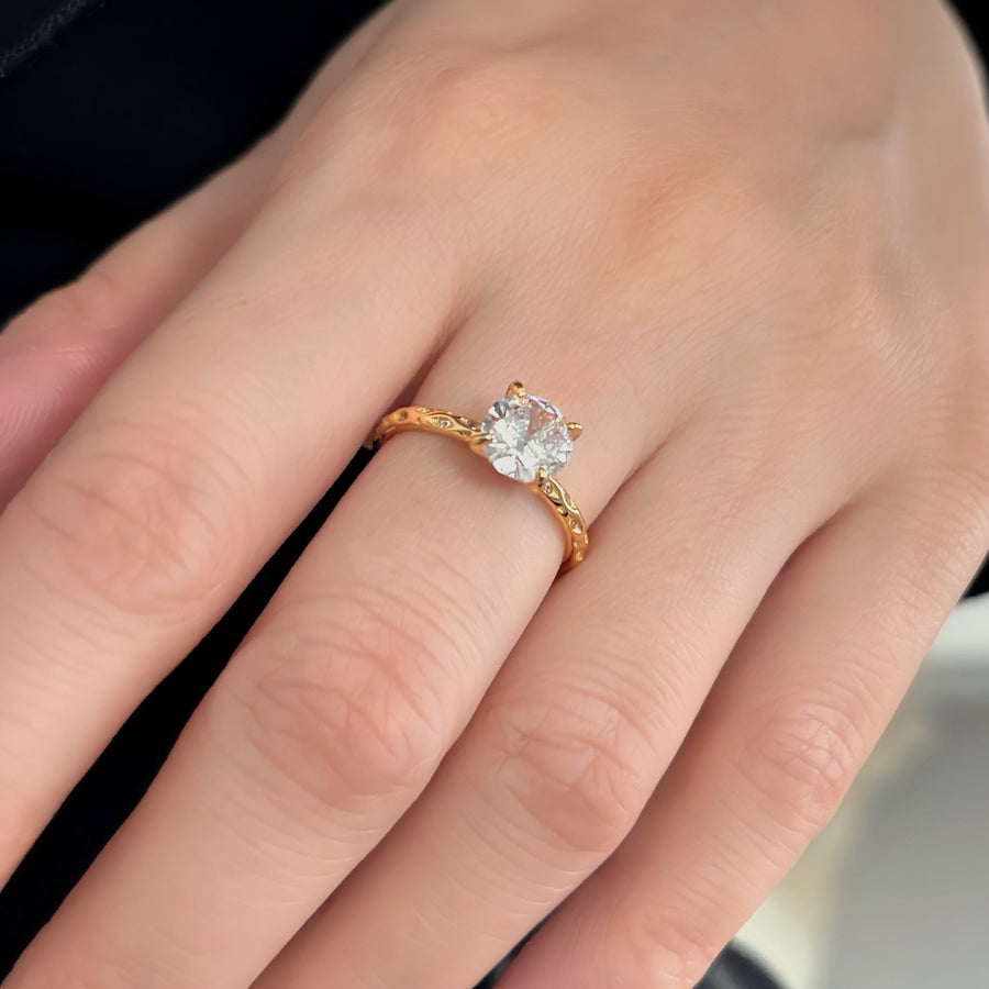 Gold vermeil Classic Ring. Featuring a brilliant round-cut cubic zircon set on a delicately textured gold band, this ring radiates timeless sophistication. 