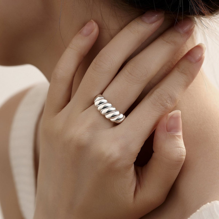 Crafted from high-quality 925 sterling silver, this ring features a sleek and modern design with a smooth, polished finish. The adjustable open-ended design ensures a comfortable fit for any finger, making it as versatile as it is charming.