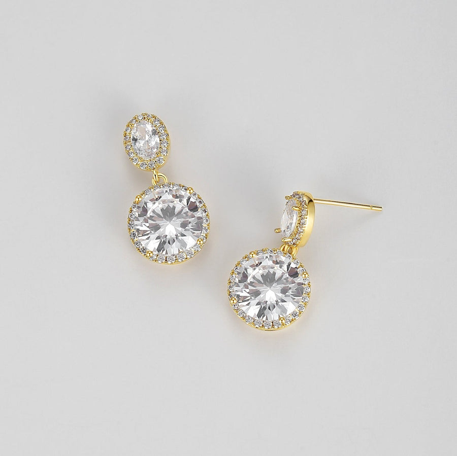 Crafted with precision-cut faceted crystals that catch and reflect light from every angle, these earrings are designed to add a touch of glamour to any outfit. The smaller stud crystal sits gracefully on the earlobe while the larger crystal dangles below, creating an eye-catching display of brilliance and shine. 