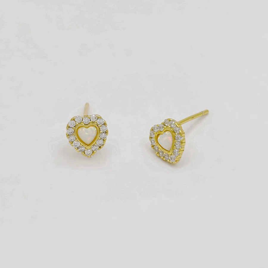 925 silver earrings. Add a touch of elegance to your style with these heart-shaped stud earrings, featuring a heart opal center surrounded by sparkling cubic zircon. Perfect for any occasion, these dainty earrings radiate timeless charm and sophistication. 