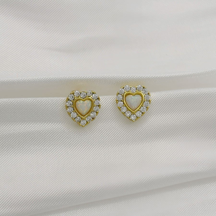 925 silver earrings. Add a touch of elegance to your style with these heart-shaped stud earrings, featuring a heart opal center surrounded by sparkling cubic zircon. Perfect for any occasion, these dainty earrings radiate timeless charm and sophistication. 