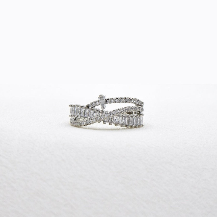 925 silver adjustable ring. This dazzling sterling silver ring showcases an intricate layered design, adorned with rows of sparkling cubic zirconia for a luxurious touch. 