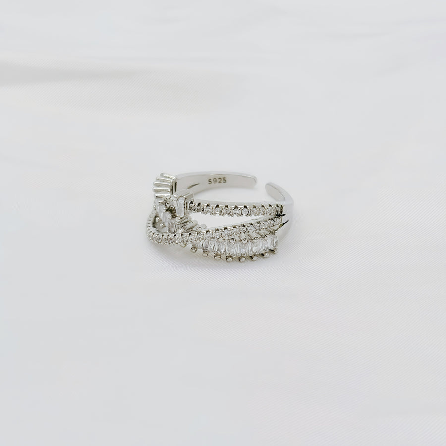 925 silver adjustable ring. This dazzling sterling silver ring showcases an intricate layered design, adorned with rows of sparkling cubic zirconia for a luxurious touch. 