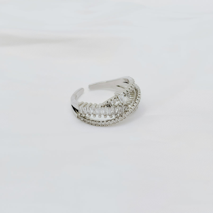 925 silver adjustable ring. This dazzling sterling silver ring showcases an intricate layered design, adorned with rows of sparkling cubic zirconia for a luxurious touch. 