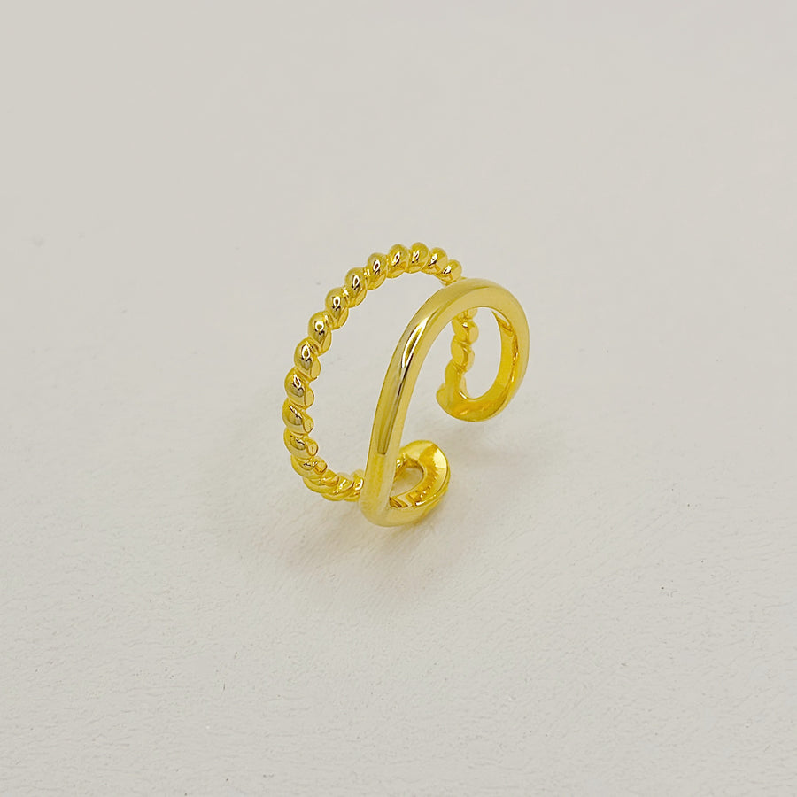 This gold ring features a sleek twisted band paired with a polished open ring, blending classic charm with modern sophistication. gold vermeil adjustable silver ring