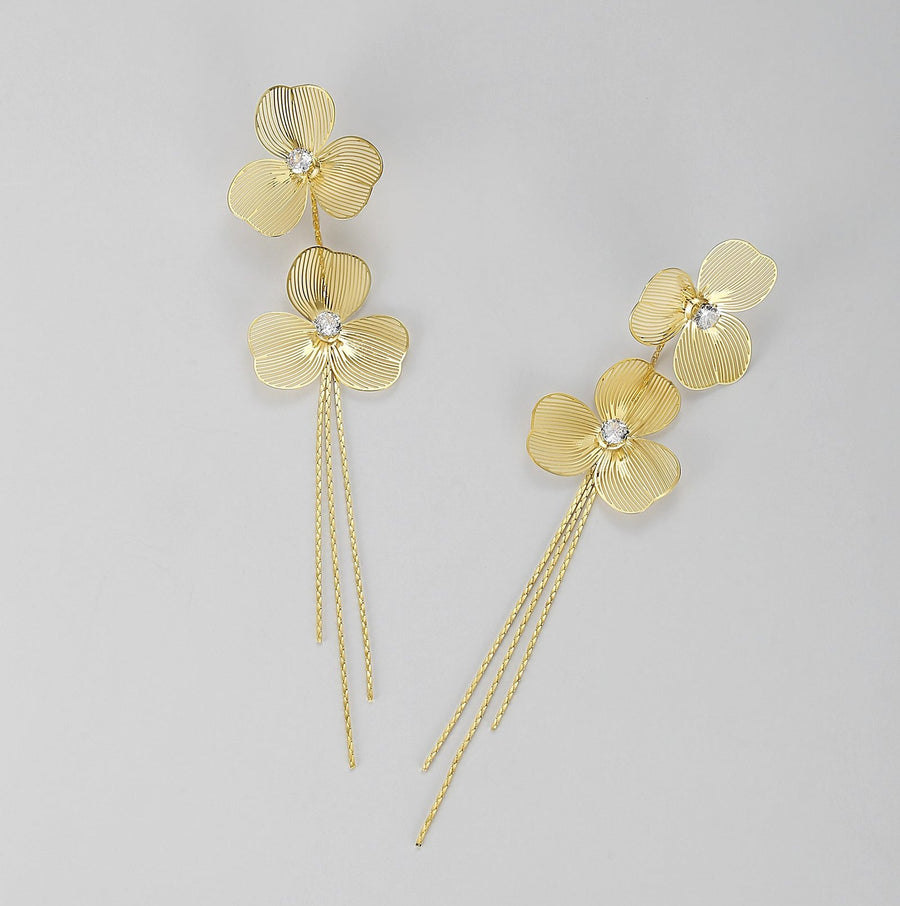 Each earring features two blossoms linked in harmonious beauty. The petals boast an incredibly lifelike texture that captures the delicate folds and curves found in nature’s own creations. At the heart of each bloom lies a sparkling cubic zirconia stone, meticulously set to catch the light from every angle. Whether for everyday elegance or special occasions, these earrings are sure to enchant. 