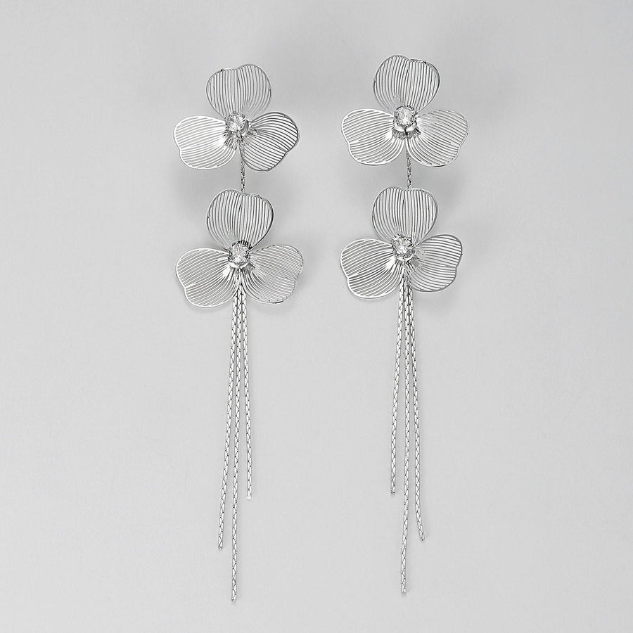 Each earring features two blossoms linked in harmonious beauty. The petals boast an incredibly lifelike texture that captures the delicate folds and curves found in nature’s own creations. At the heart of each bloom lies a sparkling cubic zirconia stone, meticulously set to catch the light from every angle. Whether for everyday elegance or special occasions, these earrings are sure to enchant. 