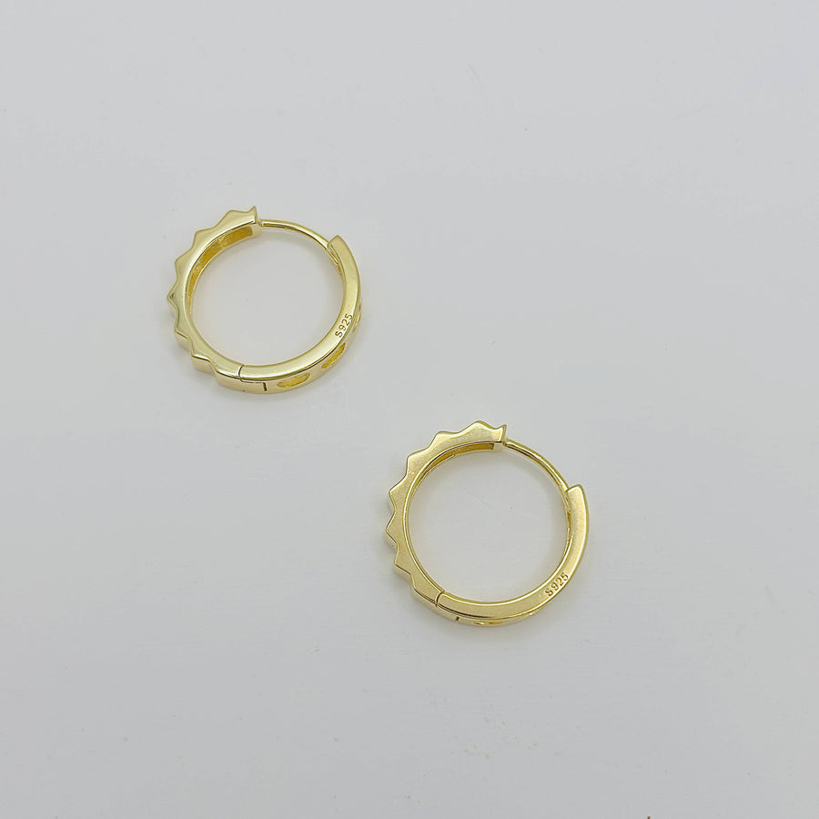 Elevate your accessory game with these sleek silver hoop earrings, designed for the modern fashion-forward individual. They are perfect for both day-to-night wear and special occasions where you want to make a subtle yet impactful statement. 