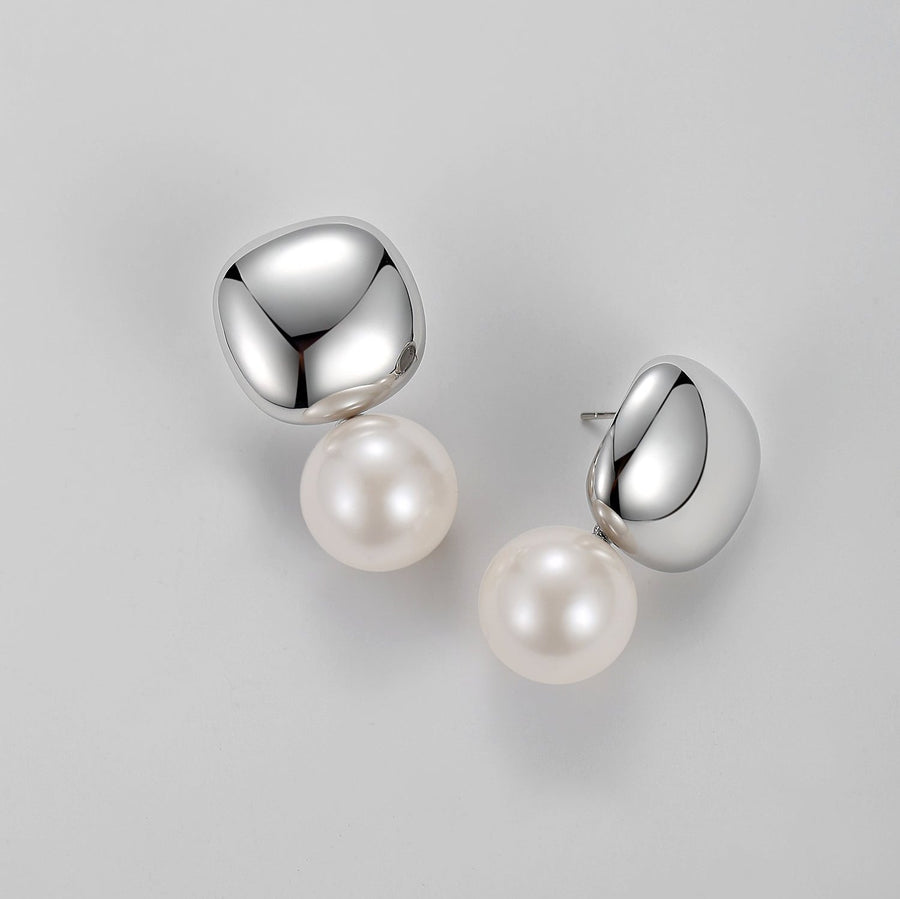 Elevate your style with the timeless charm of our Elegance Pearl Drop Earrings. Featuring a polished silver-tone stud and a luminous pearl drop, these earrings strike the perfect balance between sophistication and simplicity. Designed for both everyday wear and special occasions, they are lightweight and comfortable, making them a versatile addition to your jewelry collection. 