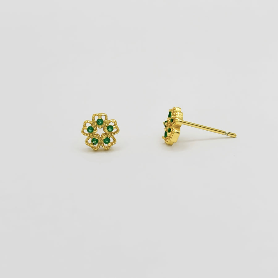 These exquisite earrings feature a delicate floral design, crafted from high-quality gold and adorned with vibrant green cubic zircon. Perfect for adding a touch of elegance and sophistication to any outfit, these earrings are a must-have accessory for any jewelry collection. 