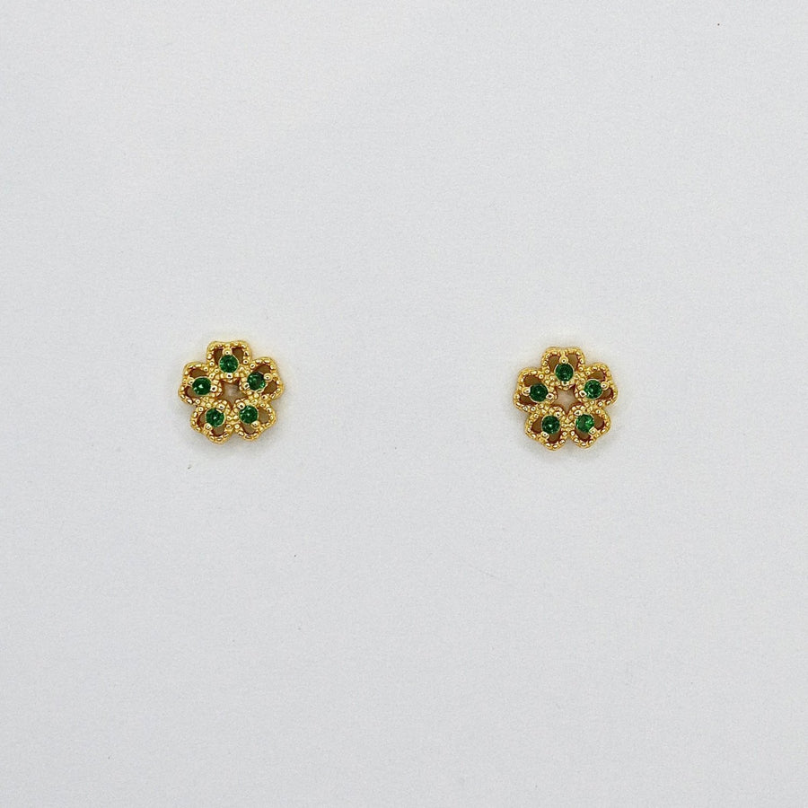 These exquisite earrings feature a delicate floral design, crafted from high-quality gold and adorned with vibrant green cubic zircon. Perfect for adding a touch of elegance and sophistication to any outfit, these earrings are a must-have accessory for any jewelry collection. 