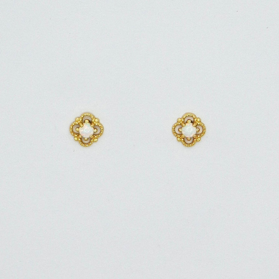 Delicately crafted, these gold-plated stud earrings feature an intricate floral design with a luminous opal center. Elegant and timeless, they add a subtle yet enchanting touch to your everyday style or special occasions. 