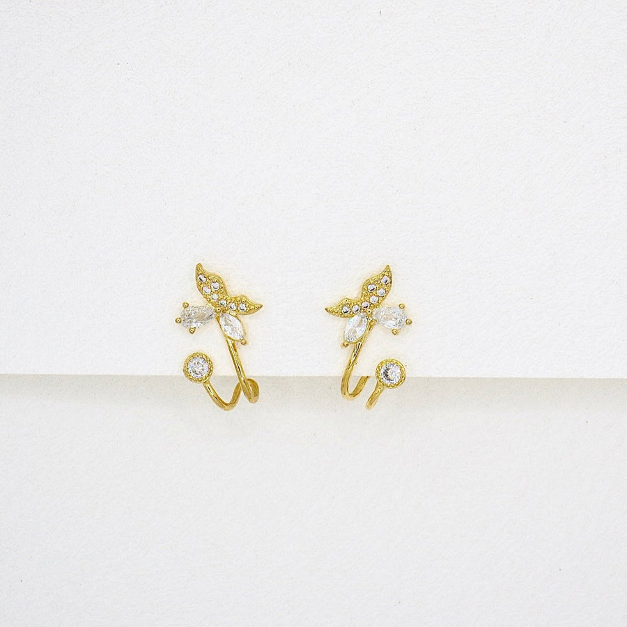 Crafted with sparkling cubic zircon and delicate gold details, these whimsical butterflies are perfect for adding elegance and charm to any look. A must-have for those who love a touch of nature's beauty.