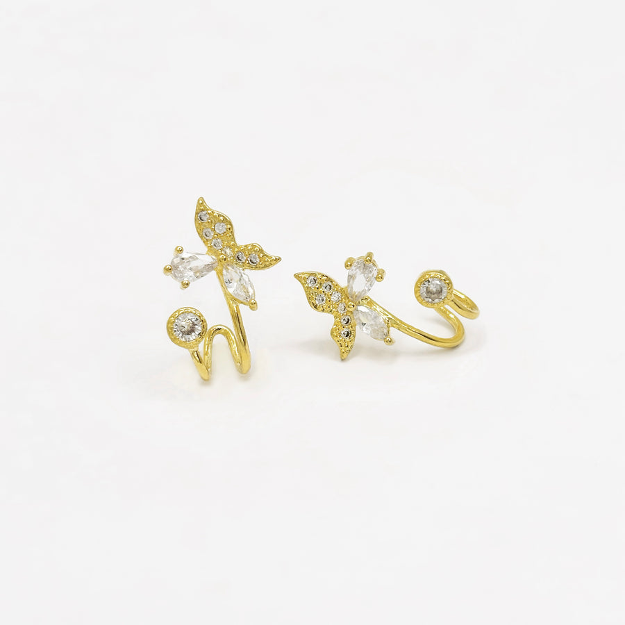 Crafted with sparkling cubic zircon and delicate gold details, these whimsical butterflies are perfect for adding elegance and charm to any look. A must-have for those who love a touch of nature's beauty.