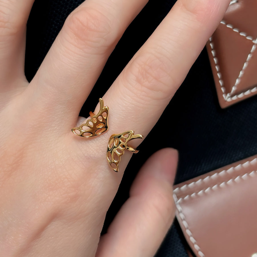 925 Silver Adjustable Ring. This butterfly-inspired ring features intricately crafted openwork wings, symbolizing grace and transformation. Perfect for both casual and formal looks.