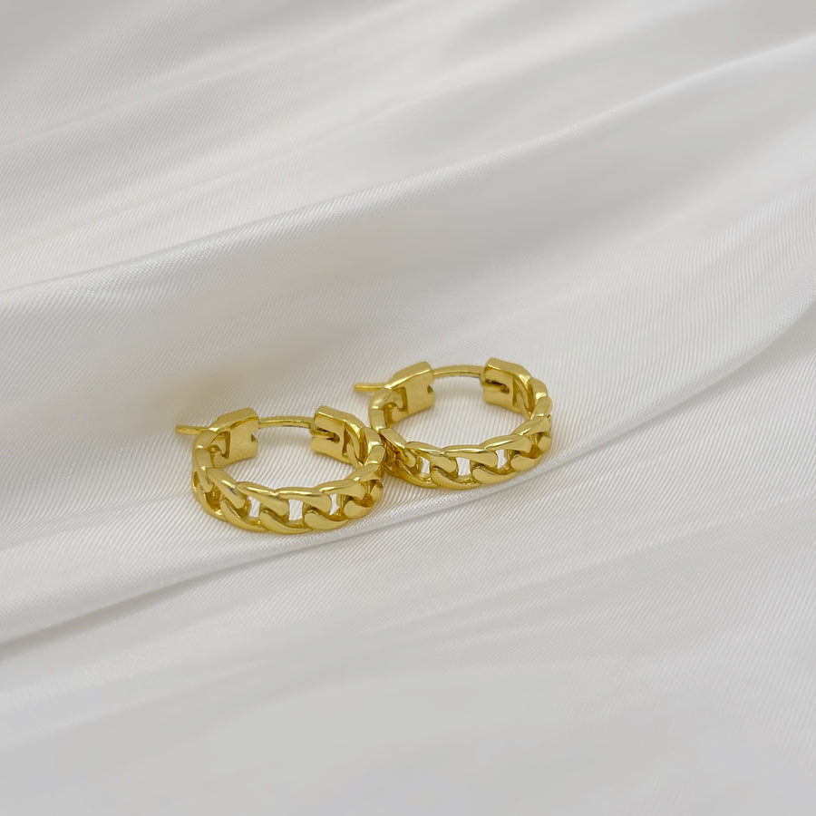 Handmade in 18k gold vermeil. The earrings feature an elegant chains of gold, creating a timeless look. The unique design and high-quality materials make these earrings a perfect accessory for any occasion.