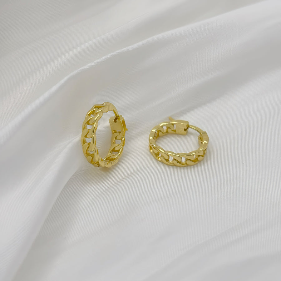 Handmade in 18k gold vermeil. The earrings feature an elegant chains of gold, creating a timeless look. The unique design and high-quality materials make these earrings a perfect accessory for any occasion.