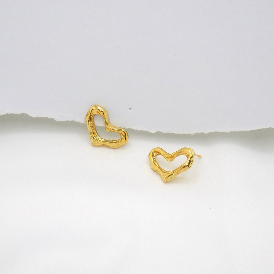 These exquisite earrings feature a unique, heart-shaped design crafted from gold vermeil, adding a touch of modern elegance to any outfit. 925 silver earrings.