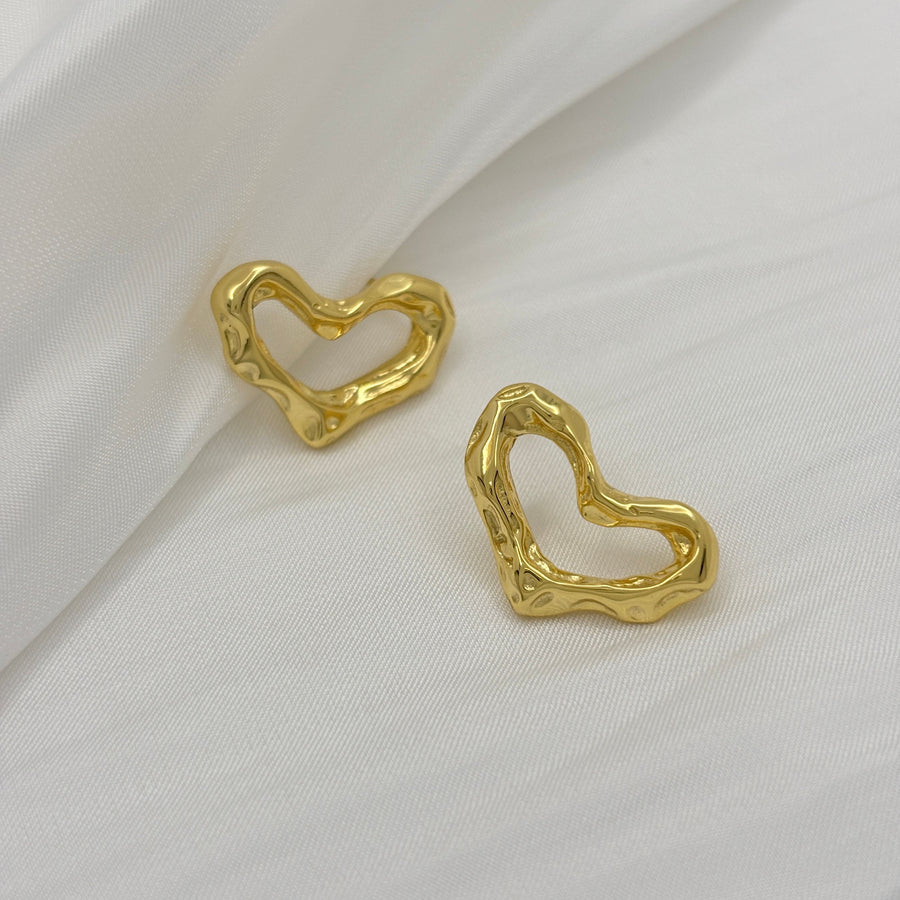 These exquisite earrings feature a unique, heart-shaped design crafted from gold vermeil, adding a touch of modern elegance to any outfit. 925 silver earrings.