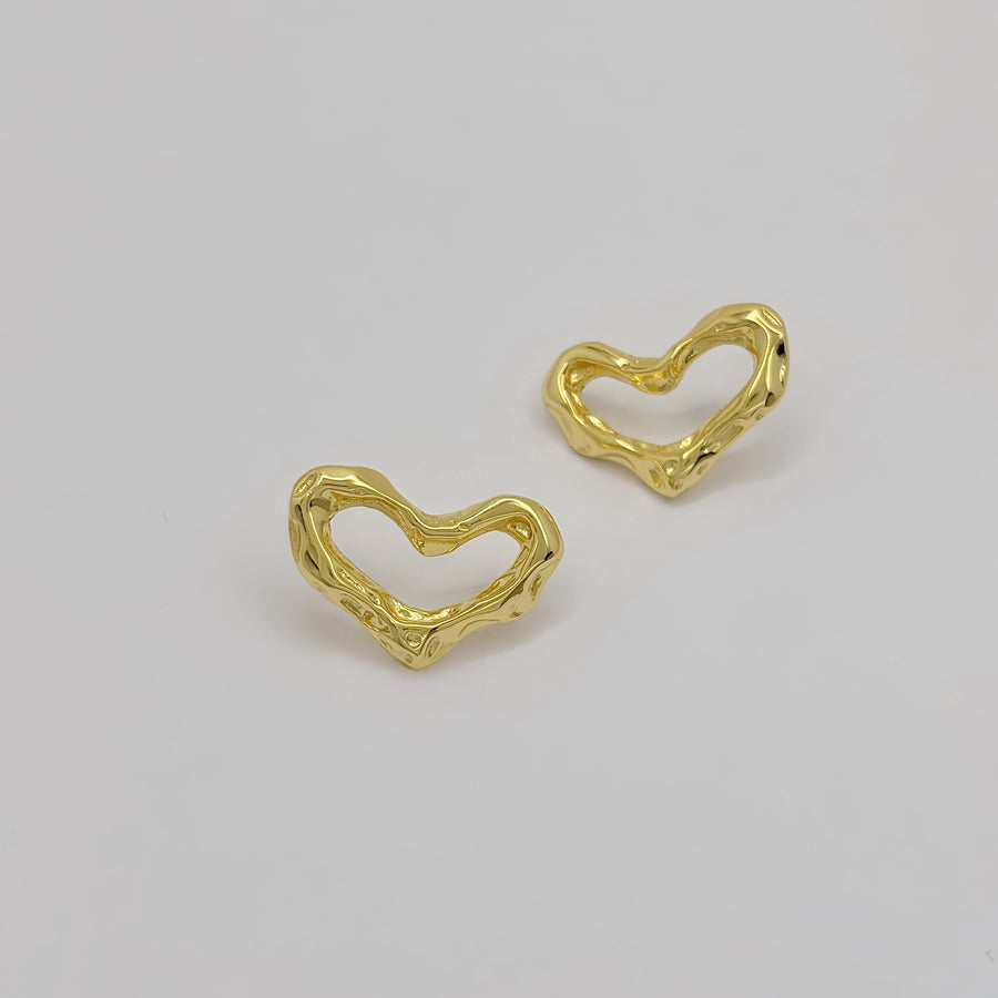 These exquisite earrings feature a unique, heart-shaped design crafted from gold vermeil, adding a touch of modern elegance to any outfit. 925 silver earrings.