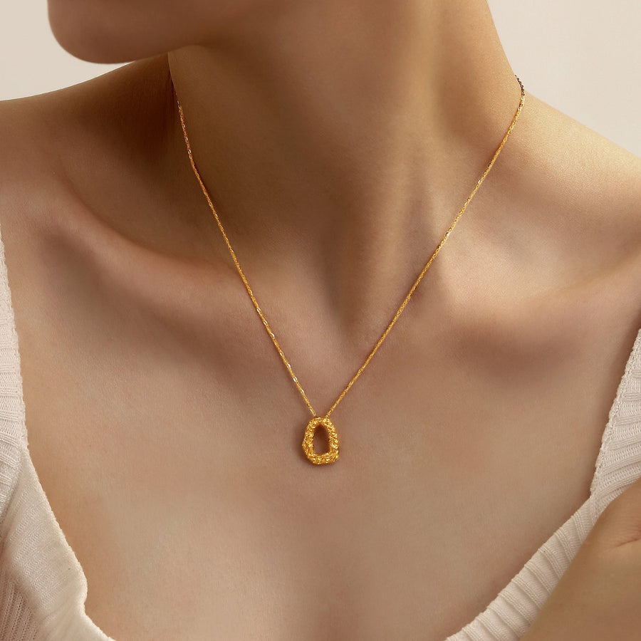 Crafted from 925 sterling silver with a lustrous gold plating, this necklace features an enchanting pendant with an organic silhouette inspired by nature’s delicate beauty. The necklace is not just an accessory; it’s a statement piece that speaks volumes about the wearer’s refined taste and appreciation for artisanal craftsmanship.