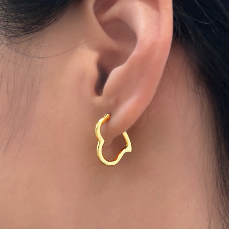 These elegant gold vermeil heart-shaped hoop earrings are a timeless addition to any jewelry collection. With their sleek design and polished finish, they effortlessly combine sophistication and charm for any occasion.