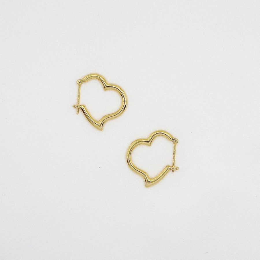 These elegant gold vermeil heart-shaped hoop earrings are a timeless addition to any jewelry collection. With their sleek design and polished finish, they effortlessly combine sophistication and charm for any occasion.