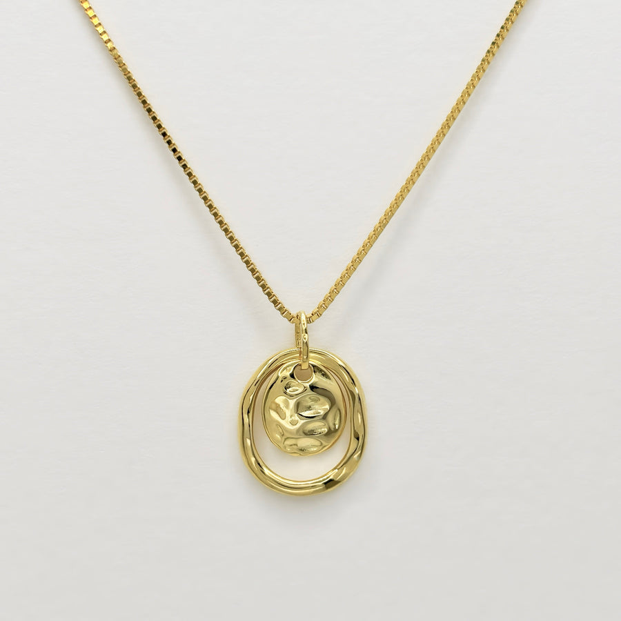 Make a bold statement with this artistic gold pendant necklace, featuring textured details for a modern, sculptural appeal. Perfectly versatile, this necklace adds a touch of elegance and individuality to your everyday style.