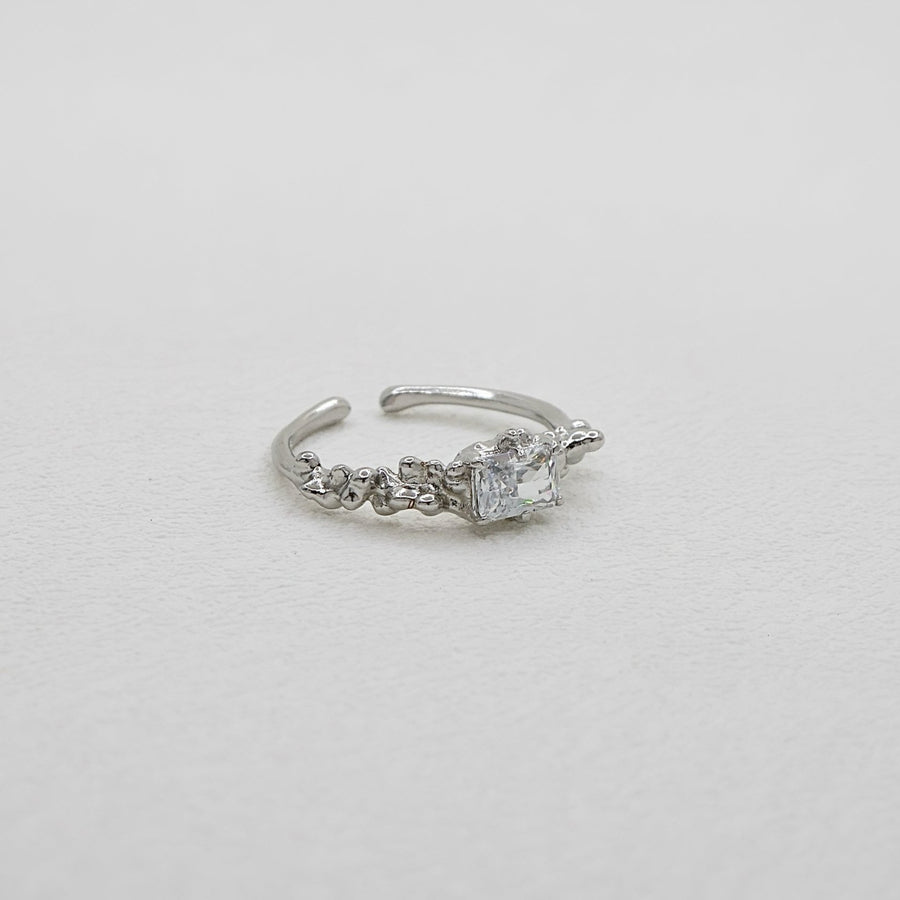 Add a touch of elegance to your look with this unique and stylish irregular face ring, featuring a lava texture and sparkling cubic zirconia inlay. Crafted from high-quality S925 sterling silver 