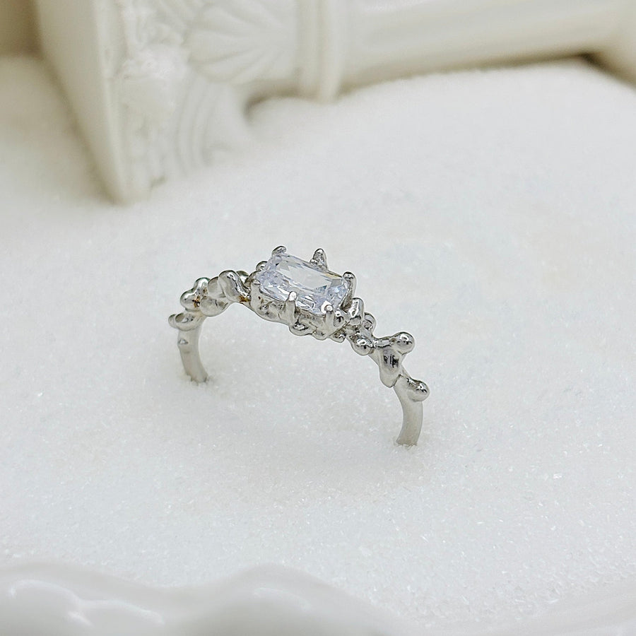 Add a touch of elegance to your look with this unique and stylish irregular face ring, featuring a lava texture and sparkling cubic zirconia inlay. Crafted from high-quality S925 sterling silver 