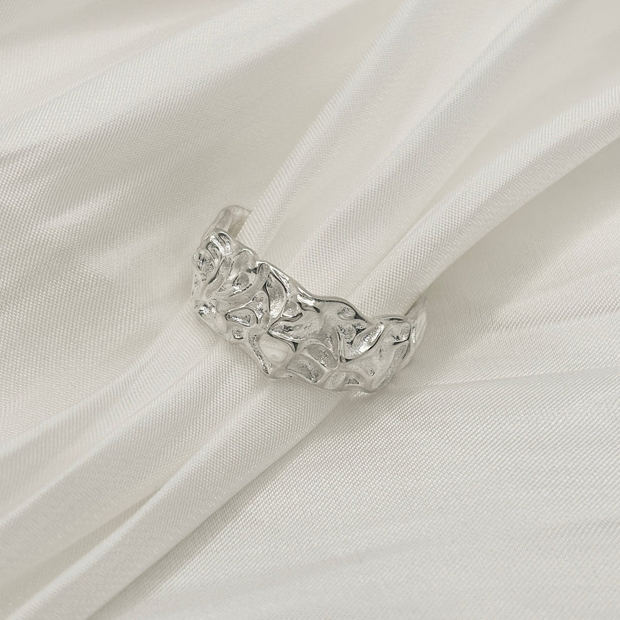 Crafted with meticulous attention to detail, this ring features intricate patterns that mimic the natural flow and cooling of molten lava. Made from high-quality sterling silver, this ring combines the untamed beauty of nature with the elegance of fine jewelry.