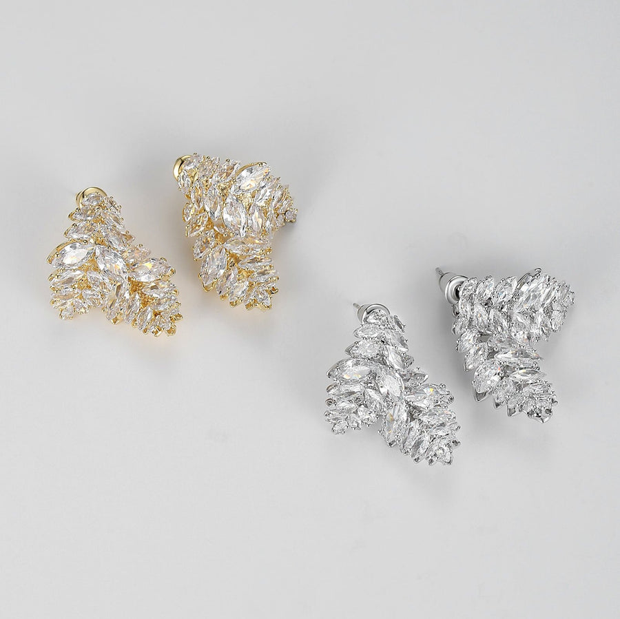 Each earring features a unique design of two overlapping leaf shapes, intricately adorned with sparkling olive-shaped cubic zirconia. Perfect for special occasions or to elevate your everyday style, these earrings are a must-have for anyone who loves detailed and opulent accessories.