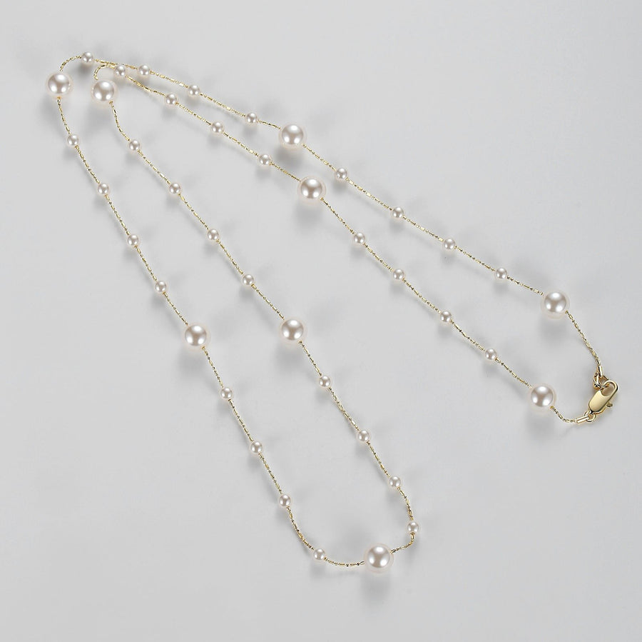 Crafted with lustrous, creamy white pearls delicately placed along fine gold-toned chains, this piece exudes sophistication and grace. Perfect for both formal occasions and everyday wear, this versatile necklace promises to be a timeless addition to any jewelry collection.