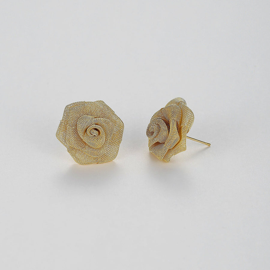 Meticulously crafted from fine metallic mesh, these studs bloom into stunning roses that exude sophistication and charm. Perfect for both daywear and evening ensembles, these Mesh Rose Earrings are sure to add a touch of refined grace to any outfit. 