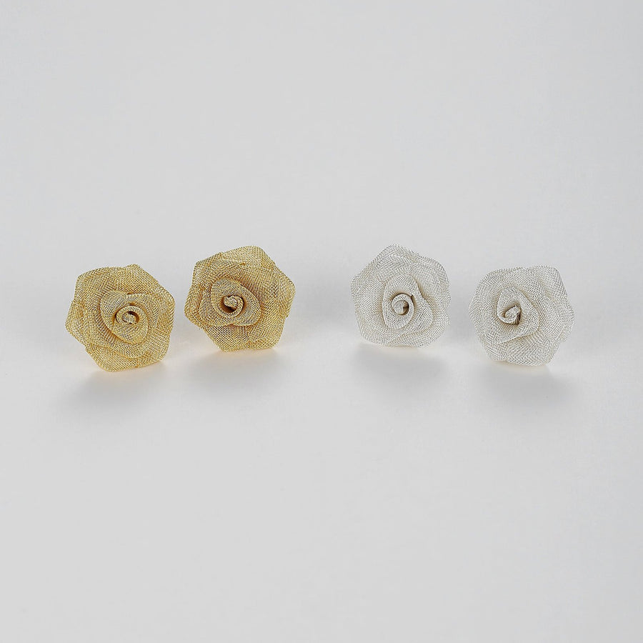 Meticulously crafted from fine metallic mesh, these studs bloom into stunning roses that exude sophistication and charm. Perfect for both daywear and evening ensembles, these Mesh Rose Earrings are sure to add a touch of refined grace to any outfit. 