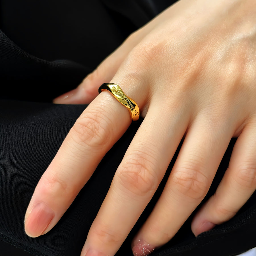 925 silver ring.  A sleek and adjustable gold-tone ring featuring elegant engraved cursive text, perfect for adding a personalized touch to any outfit. Crafted with a modern, twist design, this open-ended ring offers a timeless charm suitable for both casual and formal occasions.