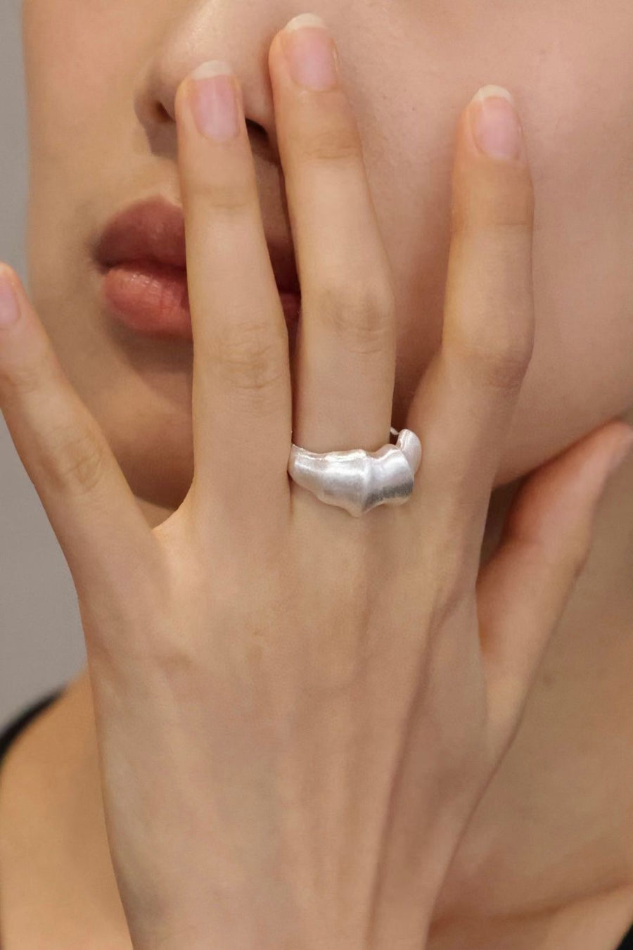 Adjustable Ring. Crafted from premium quality silver, this ring features a unique open band design, creating an abstract and artistic look. The brushed finish adds a contemporary touch, enhancing the ring’s artistic appeal. 