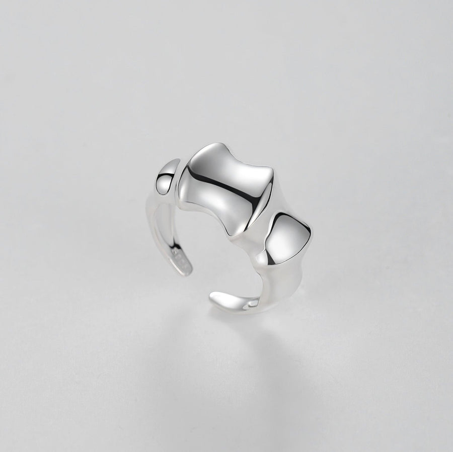 Adjustable Ring. Crafted from premium quality silver, this ring features a unique open band design, creating an abstract and artistic look. Flowing like the waves of the ocean, this ring embodies the beauty and power of nature's endless rhythm.