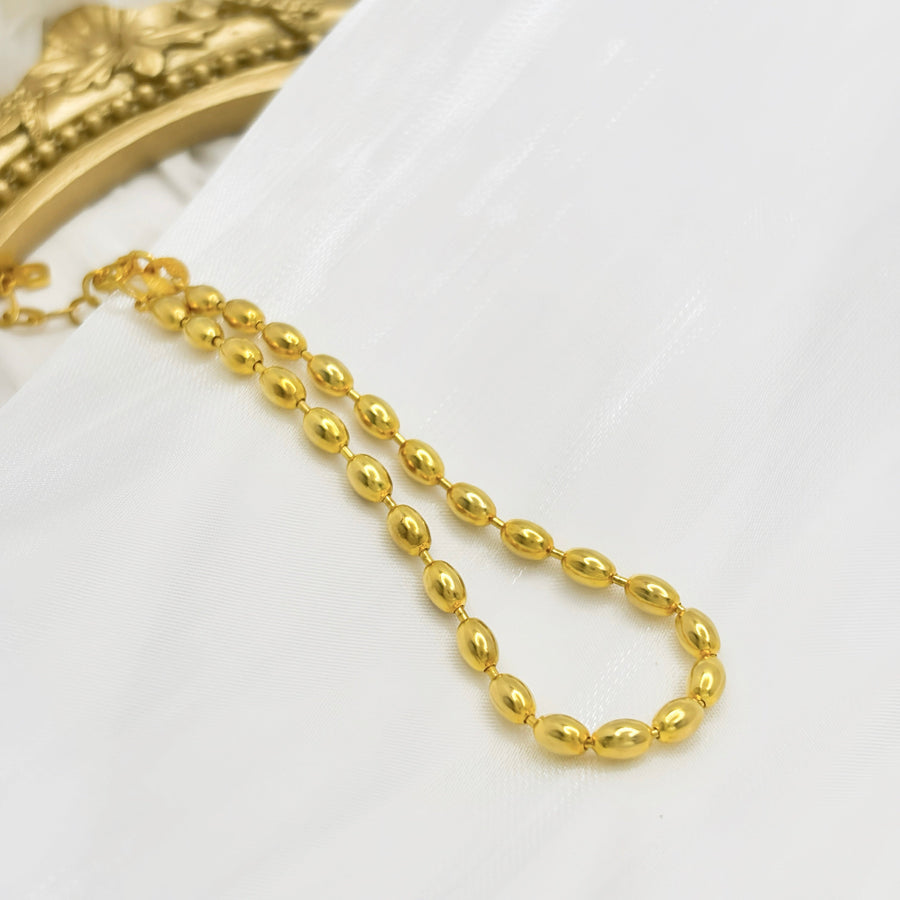 Elegant and timeless, this gold vermeil olive bead bracelet is perfect for adding a refined touch to any outfit. Featuring smooth olive-shaped beads, this bracelet is a versatile accessory, ideal for both everyday wear and special occasions.