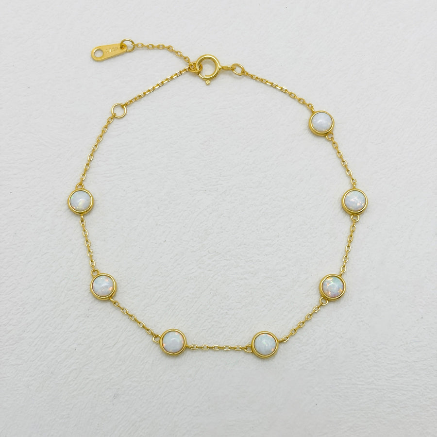 Elevate your elegance with this stunning opal bracelet, featuring radiant opals set in a delicate gold vermeil chain for a timeless look. Perfect for any occasion, this opal bracelet brings a touch of sophistication and luminous charm to your jewelry collection.