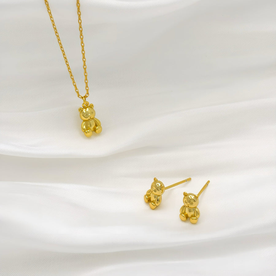 These adorable gold earrings feature a charming teddy bear design, perfect for adding a playful touch to any outfit. Crafted with attention to detail, these earrings are both cute and elegant, making them an ideal accessory for both children and adults.