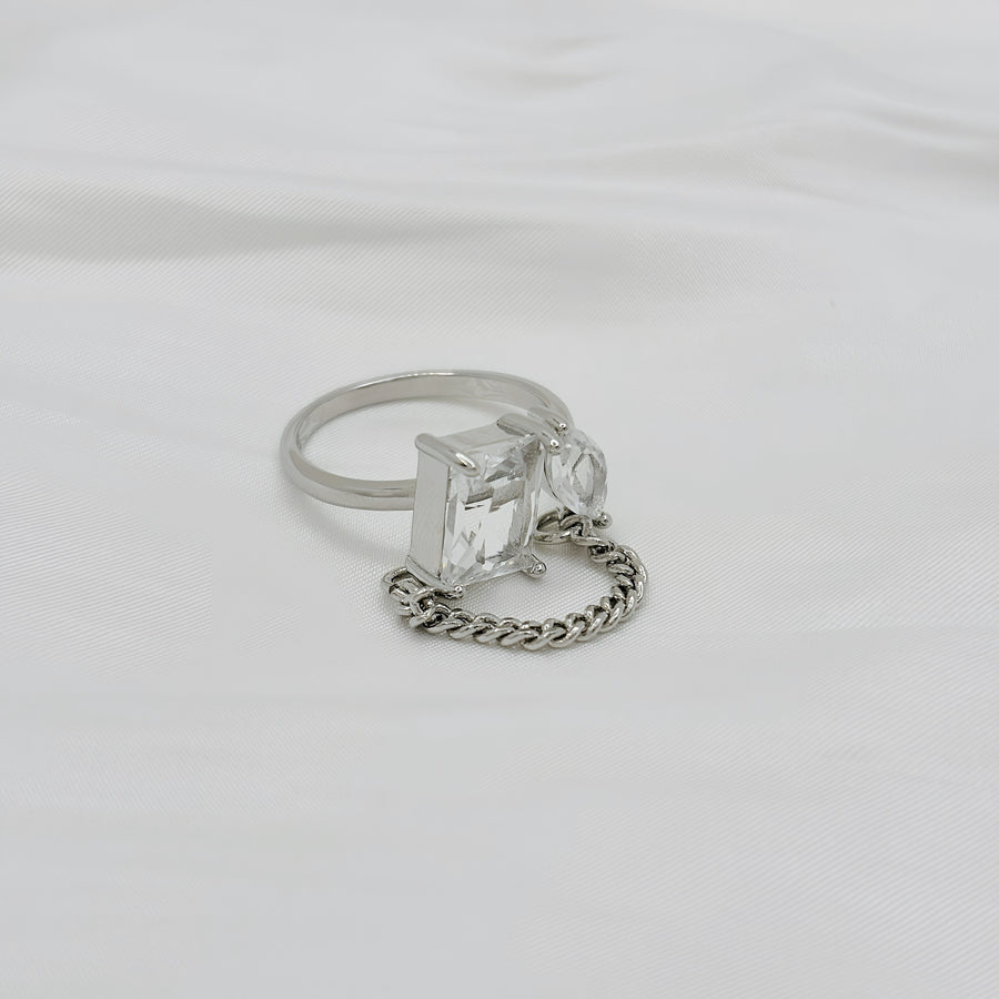 925 silver adjustable ring. This unique sterling silver ring features a bold geometric design with two sparkling gemstones connected by a delicate chain, embodying modern elegance. 