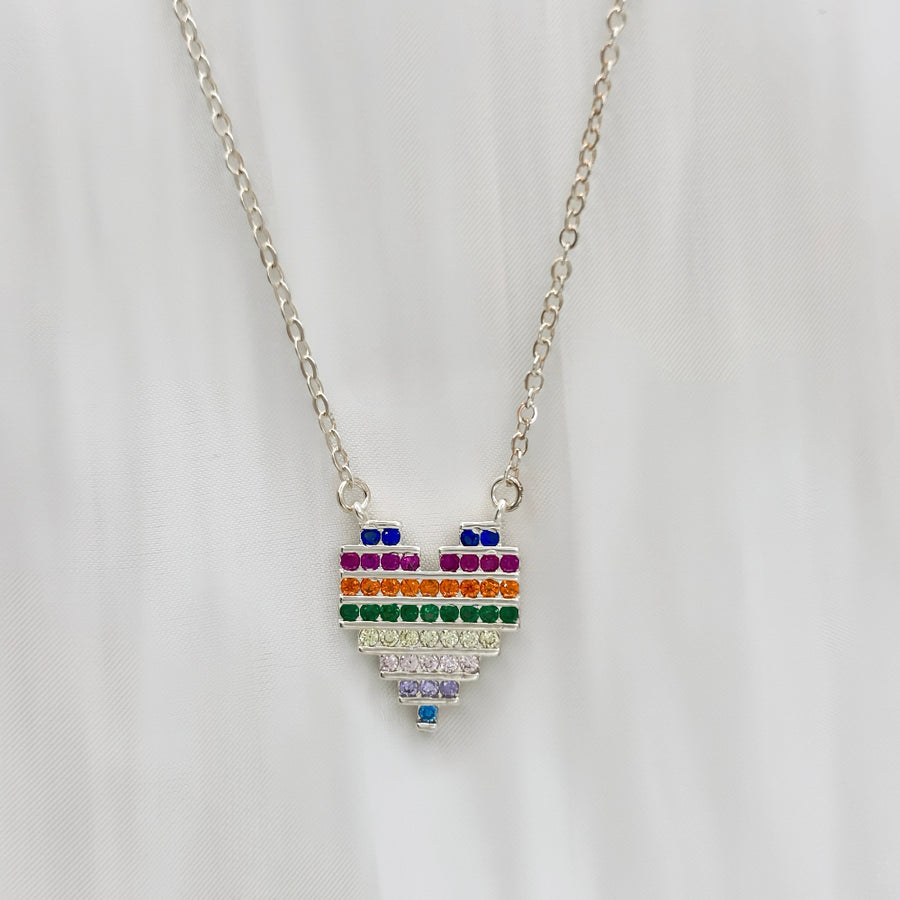 The 925 silver necklaces feature a rainbow heart-shaped pendant with colorful and vibrant cubic zirconia stones. The necklace can be beautifully layered for a stunning stacked effect that adds a burst of color and joy to your style.