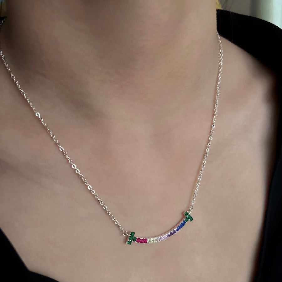 The 925 silver necklaces feature a rainbow smiling face-shaped adorned pendant with colorful and vibrant cubic zirconia stones. The necklace can be beautifully layered for a stunning stacked effect that adds a burst of color and joy to your style.