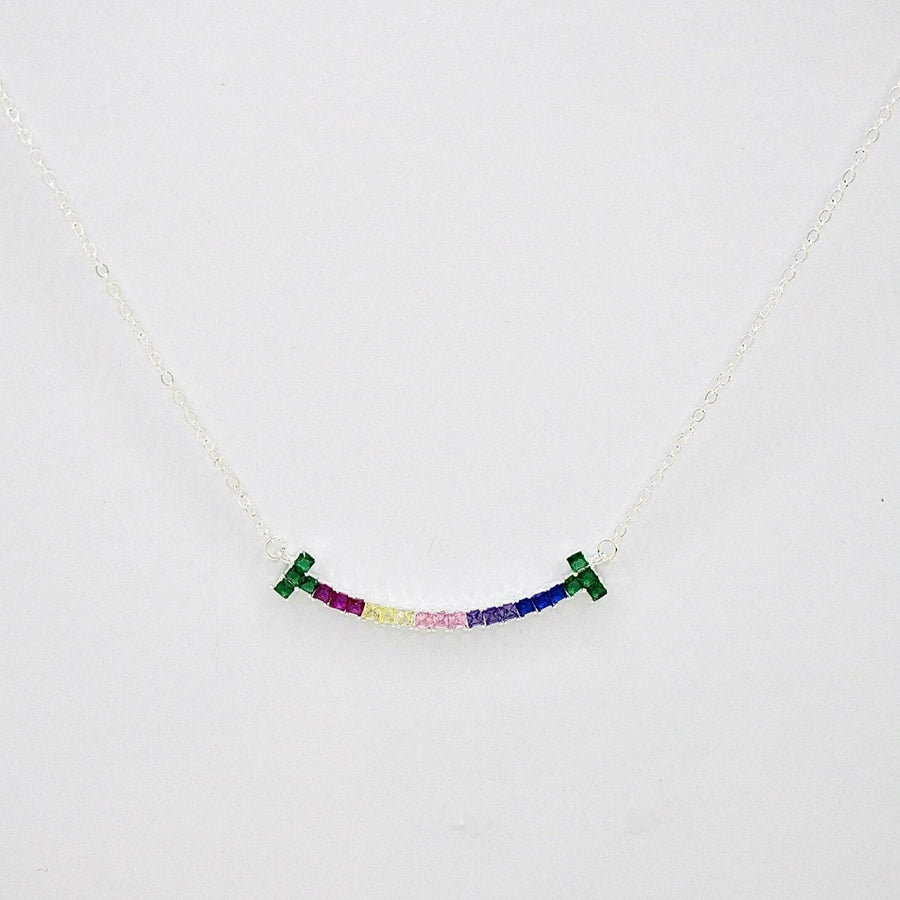 The 925 silver necklaces feature a rainbow smiling face-shaped adorned pendant with colorful and vibrant cubic zirconia stones. The necklace can be beautifully layered for a stunning stacked effect that adds a burst of color and joy to your style.