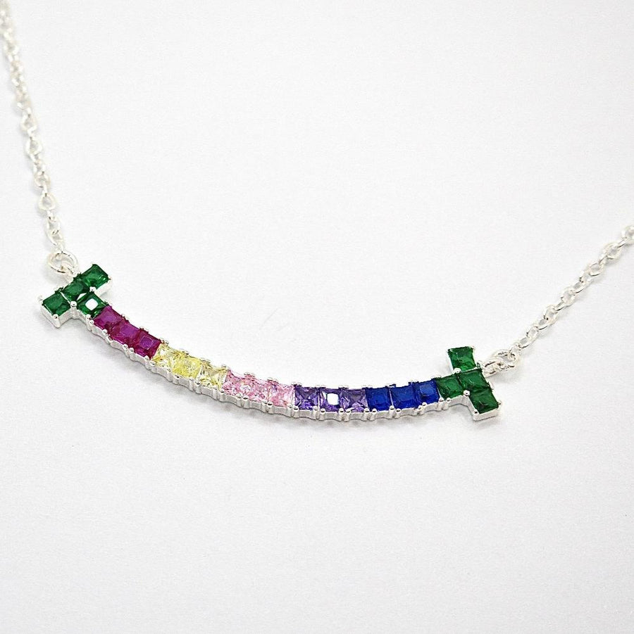 The 925 silver necklaces feature a rainbow smiling face-shaped adorned pendant with colorful and vibrant cubic zirconia stones. The necklace can be beautifully layered for a stunning stacked effect that adds a burst of color and joy to your style.